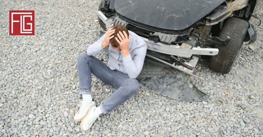 man beside car crash